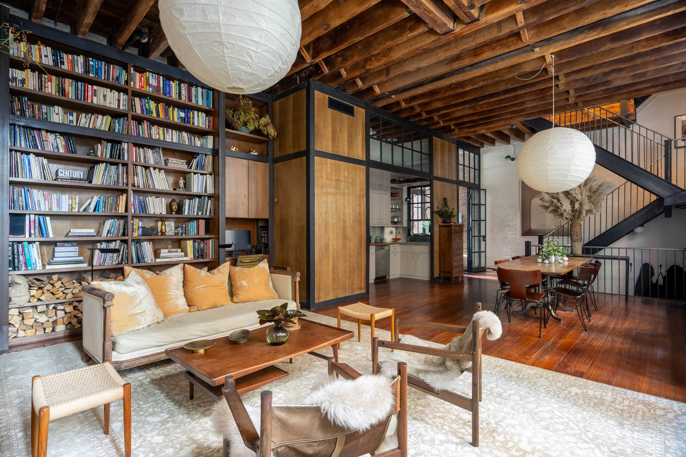 Living room with built-in elements formed from the salvage of a freight elevator