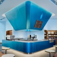 Traditional Thai lanterns inform blue-and-gold Bangkok cafe interior