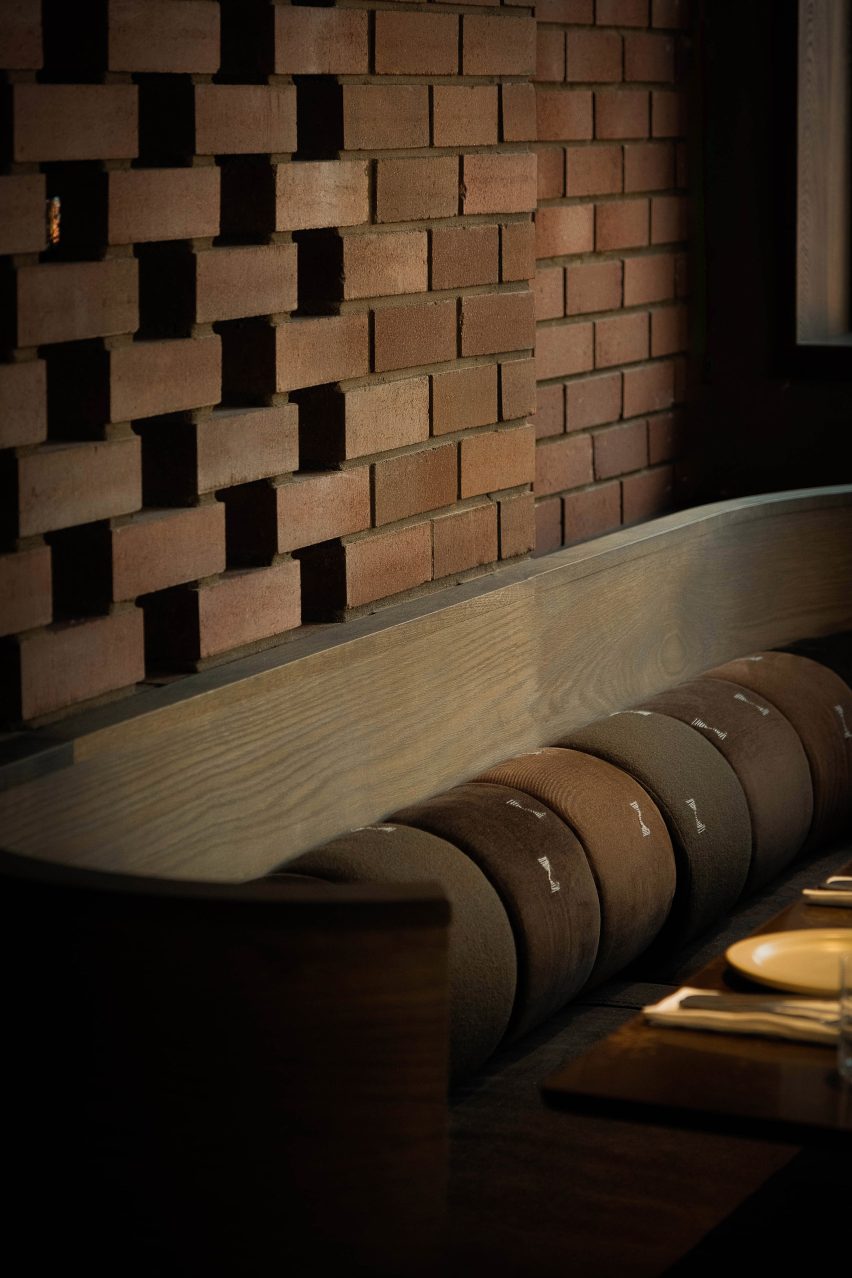 Bricks and green sofa