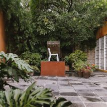 Recycled-plastic plinths hold furniture at "secret" Barragán house in Mexico