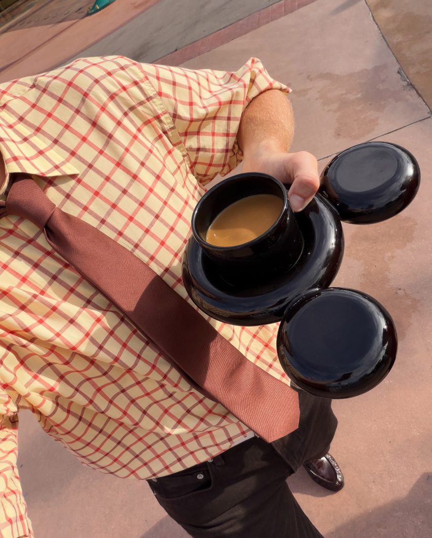 Man holding cup and saucer