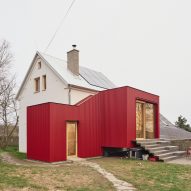 Facha Architekti adds "deliberately distinct" red extension to former-pigsty home