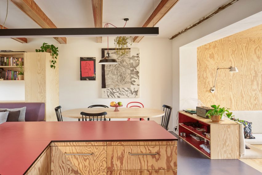 red features in the interior as the prominent accent colour, connecting the interior with the statement metal-cladding of the exterior