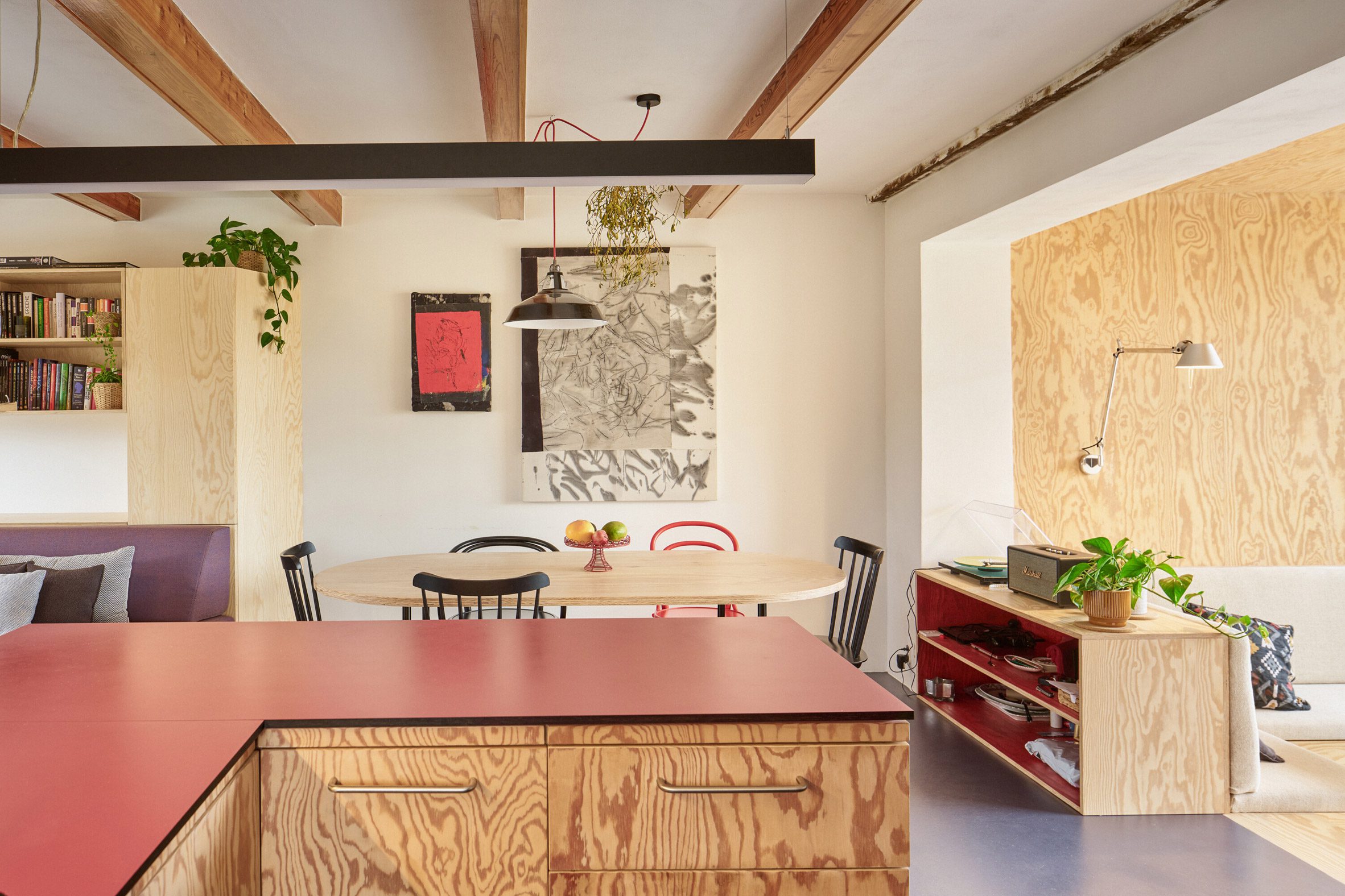 red features in the interior as the prominent accent colour, connecting the interior with the statement metal-cladding of the exterior