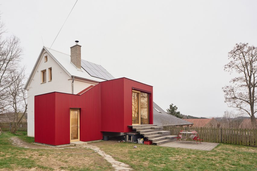 the extension adds seating steps and a terrace to improve outdoor access