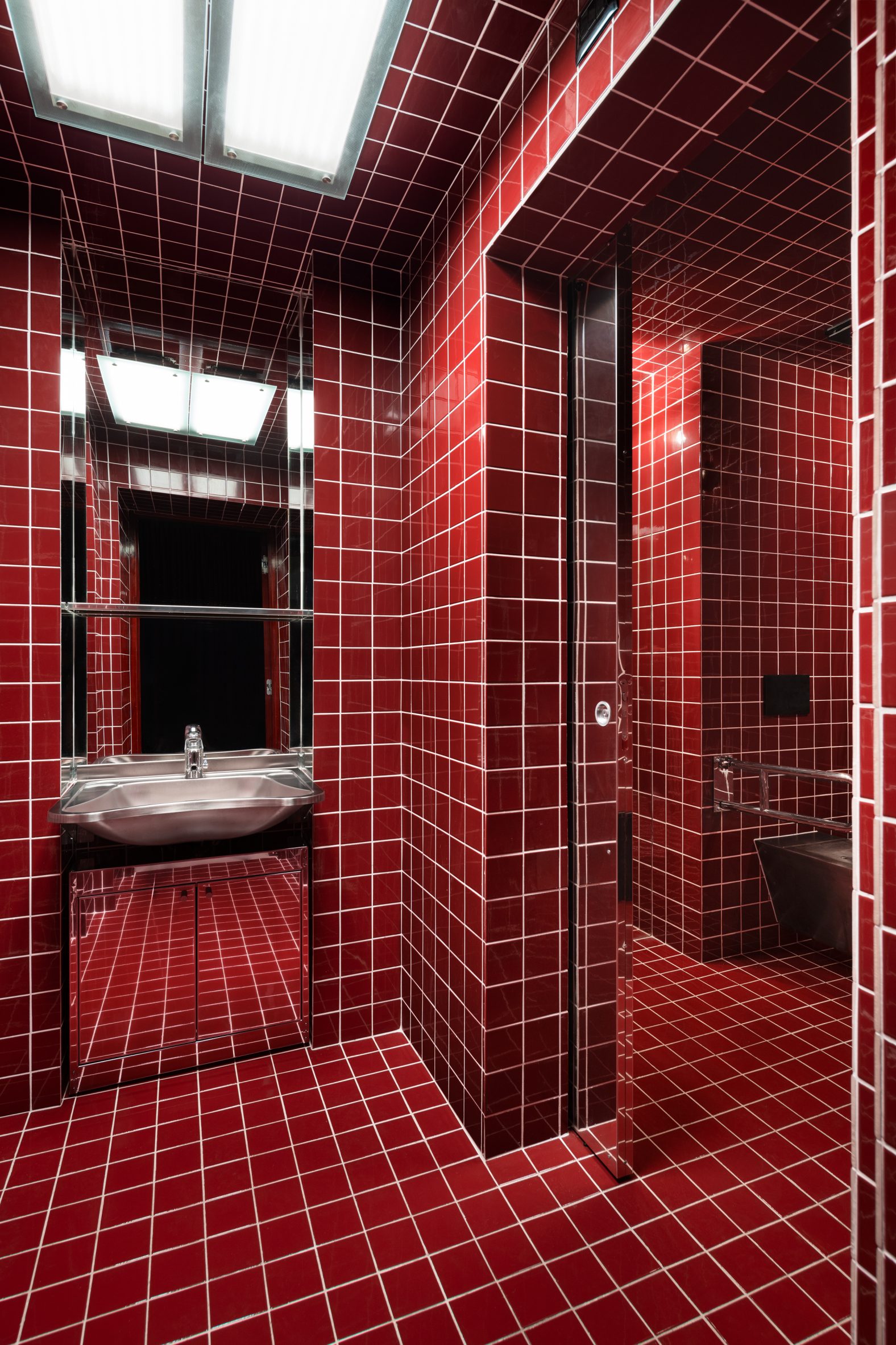 Bright red-tiled bathroom