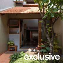 Terracotta tiles enclose skinny Roof House in Vietnam